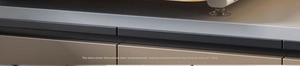 Close-up of kitchen rack base showing anti-slip suction cup feet and metal frame detail