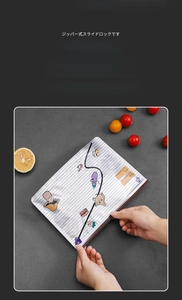 Close-up of airtight aluminum foil storage bag with slider zipper and cartoon pattern
