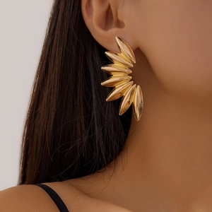 Exaggerated 18K gold-plated petal stud earrings worn by a fashion model on a clean background