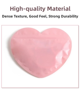 Pink heart-shaped resealable storage bag with secure ziplock for jewelry and candy