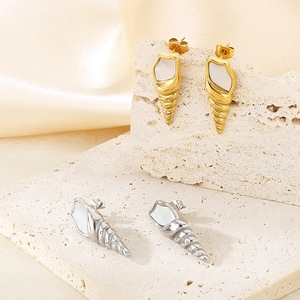 Elegant conch shell earrings in gold and silver with inlaid diamonds and mother of pearl