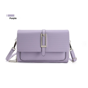 Detail of lavender purple crossbody bag featuring woven texture flap and silver metal buckle