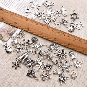 Retro Christmas alloy charms collection with silver snowflakes and Santa with wooden ruler
