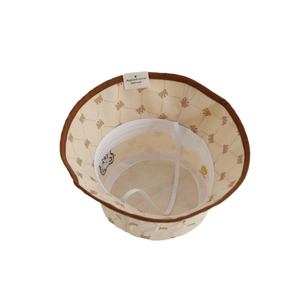 Beige kids corduroy bucket hat with brown bear patterns and a wide brim for autumn
