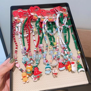 Handmade Christmas beaded necklace set with resin charms like Santa and Reindeer