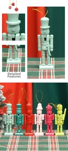 Detailed close-up of 6 colorful 13cm wooden nutcracker ornaments with gold hanging strings