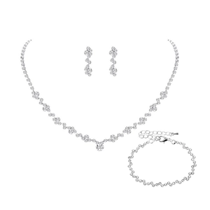 Macro shot of silver bridal jewelry set with sparkling rhinestones and crystal drops