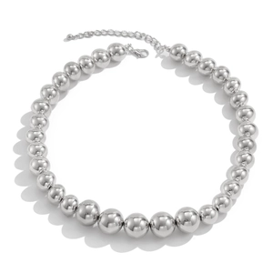 Detailed view of silver CCB beaded necklace featuring polished spheres and lobster clasp