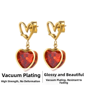 Detail of red heart gemstone earrings with gold vacuum plating and faceted cutting