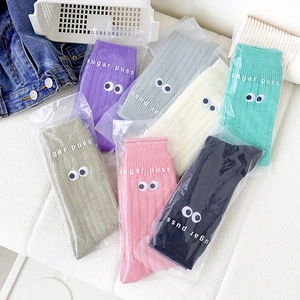 Colorful candy-colored slouch socks with embroidered eye patterns in multiple vibrant shades