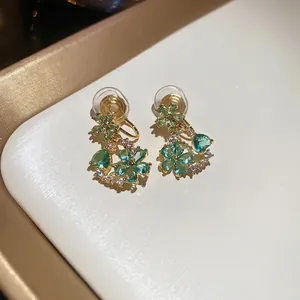 18k gold plated flower stud earrings with green crystals and white zircon accents