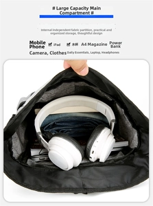 Macro detail of spacious backpack main compartment with organized storage for electronics