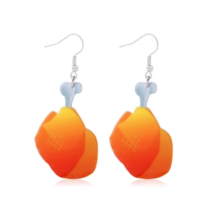 Detail view of cartoon fried chicken leg earrings with silver hooks on white background