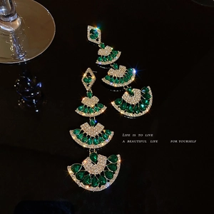 Elegant emerald green fan tassel drop earrings with sparkling rhinestones in gold setting