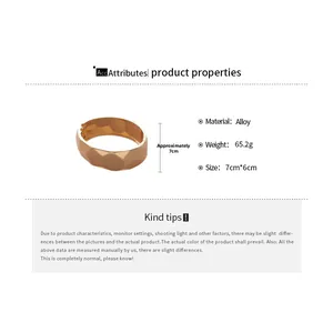 Detailed specs of the gold alloy geometric bangle showing 7cm diameter and 65.2g weight