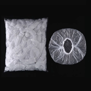 Disposable transparent plastic shower caps with elastic band in bulk packaging