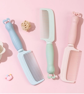 Detailed view of cute cartoon rabbit-shaped hair combs with fine teeth in pastel colors