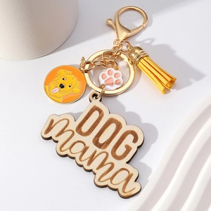 Dog Mama wooden keychain with golden retriever charm and colorful tassel on gold ring