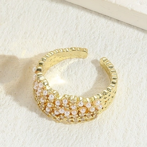 Luxurious adjustable gold ring featuring rows of white pearls and shimmering cubic zirconia