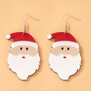 Macro detail of acrylic Santa Claus earrings with shiny red glitter and festive design