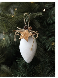 Flocked white teardrop Christmas ornament with pine cones on green tree branches