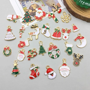 Assorted colorful enamel Christmas charms featuring Santa and reindeer for DIY jewelry