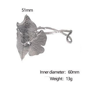 Detail showing 51mm ginkgo leaf height and 60mm diameter of the silver steel cuff