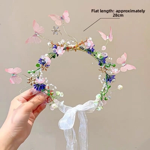 Close-up of handmade floral headband with pink butterflies and 28cm length detail