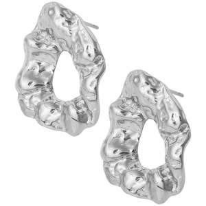 Macro shot of silver 304 stainless steel earrings with irregular hammered texture