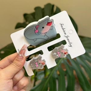 Cute hippo acrylic hair clip and stud earrings set on a white display card
