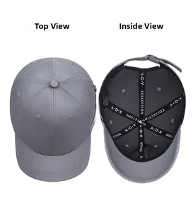 Detail view of the gray cotton baseball cap featuring interior branded tape and top profile