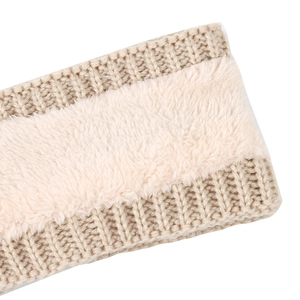 Detail of warm winter cable knit headband with soft cream fleece lining and ribbed edges