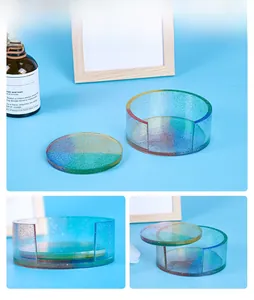 Detailed view of rainbow glitter resin coasters and matching cylindrical storage box