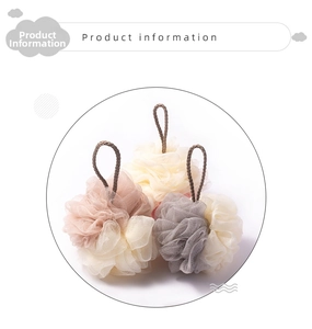Detail view of large three-color bath sponge set with thick hanging ropes for storage