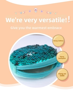 Detail of turquoise sequin coin purse with reversible sequins and plush white lining