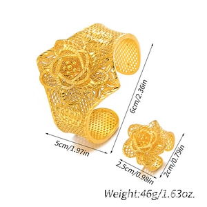 Detailed view of gold filigree flower bracelet and ring set with size measurements