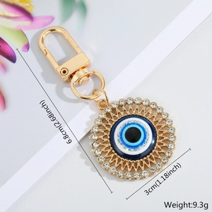 Detail of blue evil eye keychain with rhinestones and measurement specs 3cm diameter