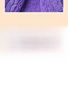 Detailed close-up of purple coral fleece fabric showing high-density plush texture and stitching
