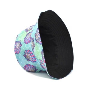 Detail of reversible bucket hat with ocean shell print and solid black lining