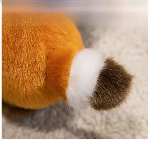 Detailed macro view of fluffy orange and brown striped plush tail with soft texture