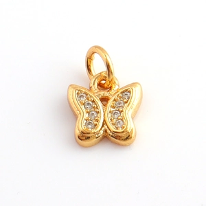 Detailed close-up of a gold-plated butterfly charm with micro-pave cubic zirconia stones