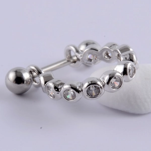 Macro view of silver stainless steel stud earring with micro-set cubic zirconia crystals