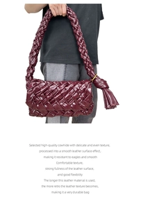 Detail of burgundy oil wax leather weave and signature knot on the crossbody bag