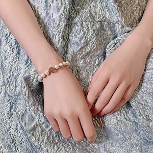 Elegant strawberry crystal and freshwater pearl bead bracelet for women on wrist