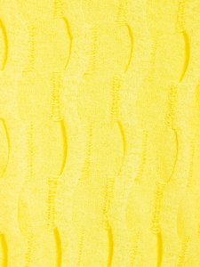 Primer plano de punto amarillo con textura ondulada y detalles de efecto gastado