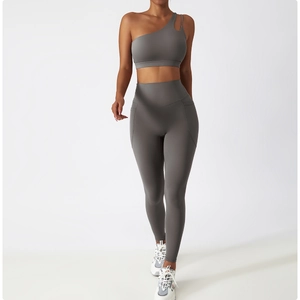 Detail view of high-waisted yoga pants side pocket and moisture-wicking fabric