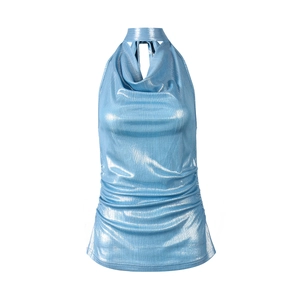 Detail of blue metallic halter top showing shimmering fabric texture and draped cowl neck
