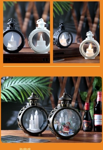 Detail of vintage Christmas lanterns with LED candles and festive Santa Claus patterns