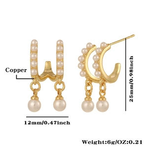 Detail view of gold pearl earrings with 12mm width and 25mm height measurements