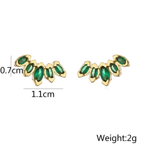 Detail shot of geometric gold earrings with marquise green zircon measuring 1.1cm by 0.7cm
